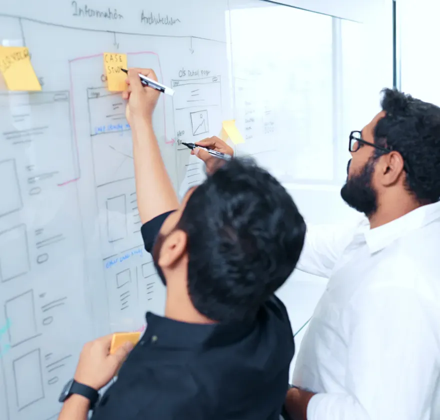Prudential Financial UX Research Team mapping wireframes and sticky notes during UX research for the Prudential Financial digital insurance platform.